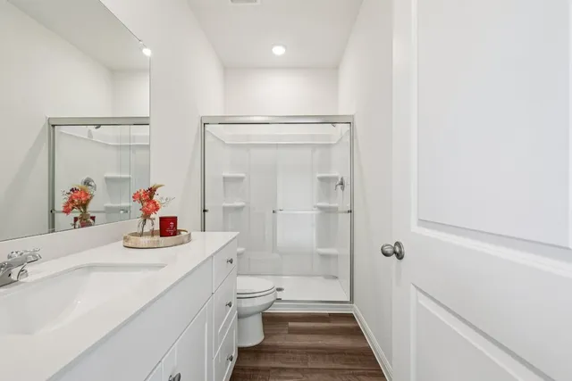 a bedroom with a bed and a desk