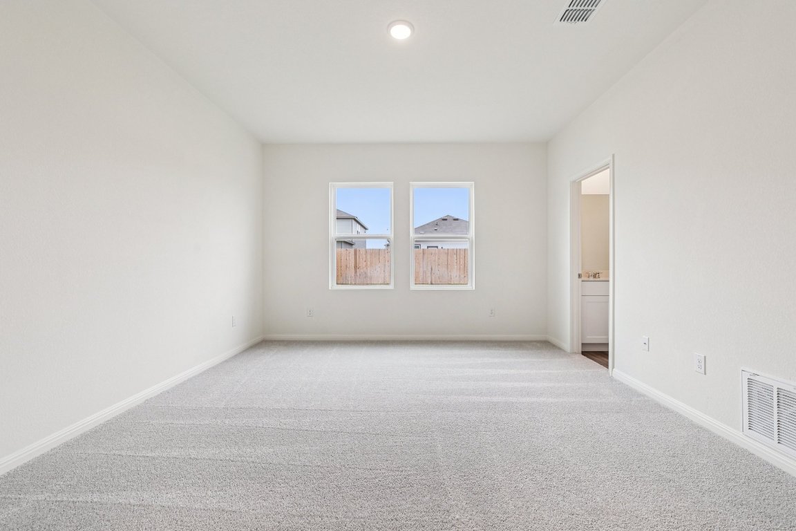 1516 Morris Loop San Marcos, TX 78666 - Photo 19 of 40 Unfurnished room featuring carpet floors and recessed lighting
