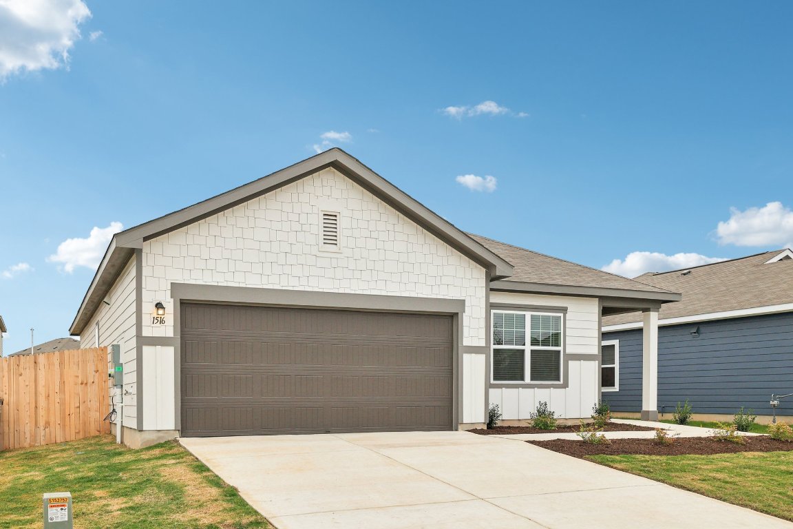 1516 Morris Loop San Marcos, TX 78666 - Photo 2 of 40 Ranch-style home featuring concrete driveway and an attached garage