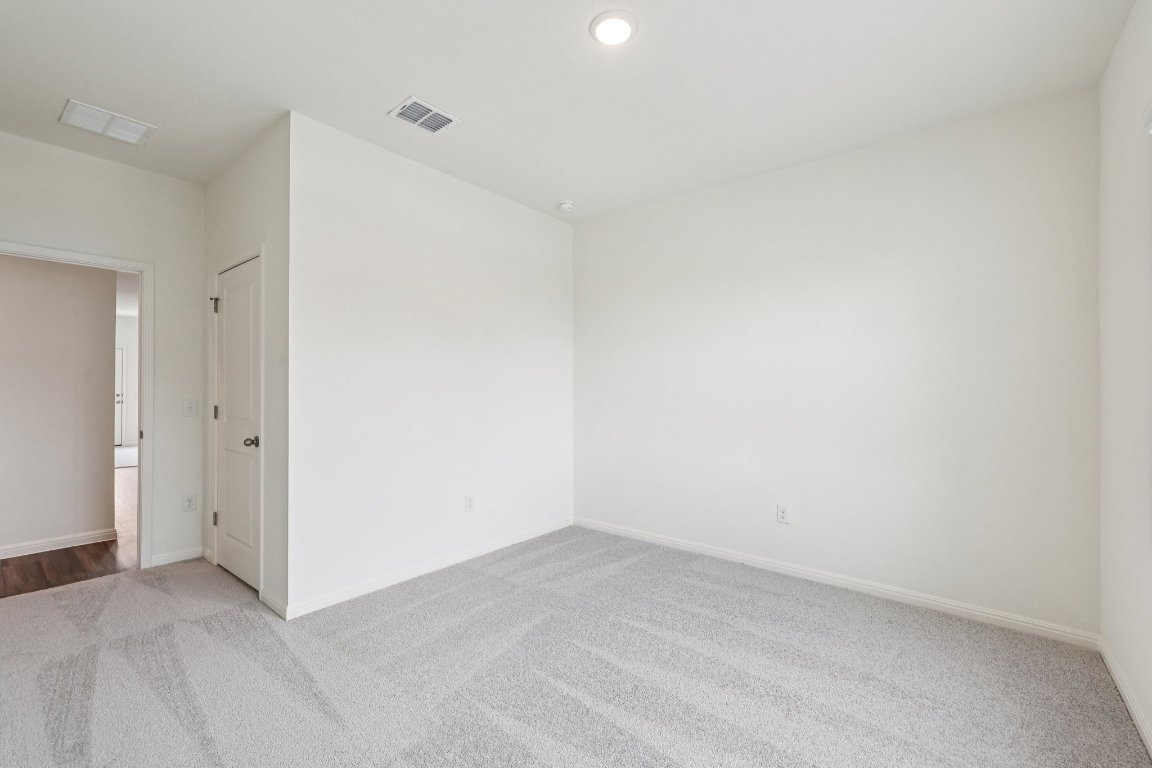 1516 Morris Loop San Marcos, TX 78666 - Photo 29 of 40 Carpeted empty room with baseboards