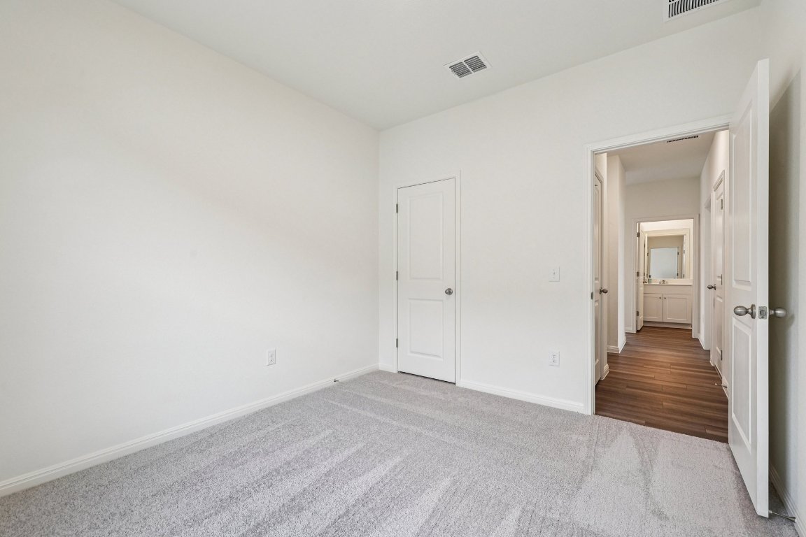 1516 Morris Loop San Marcos, TX 78666 - Photo 31 of 40 Unfurnished bedroom featuring carpet flooring and baseboards