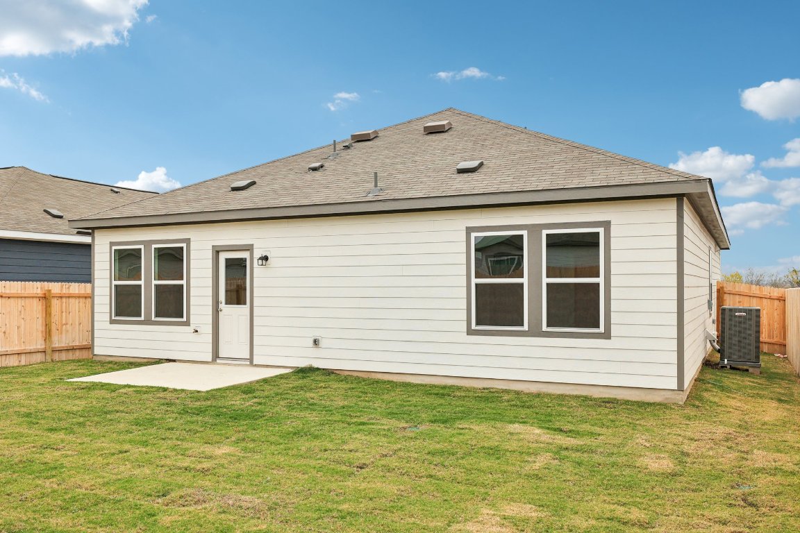 1516 Morris Loop San Marcos, TX 78666 - Photo 33 of 40 Rear view of property with a fenced backyard, a patio, and a shingled roof