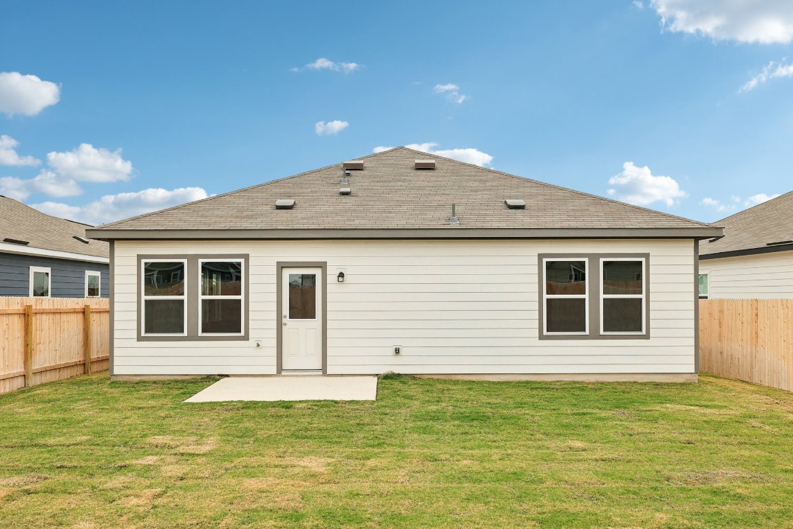 1516 Morris Loop San Marcos, TX 78666 - Photo 34 of 40 Back of house featuring a fenced backyard, a patio area, and roof with shingles