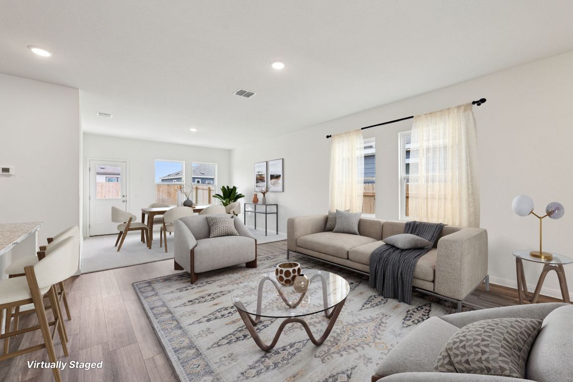 1516 Morris Loop San Marcos, TX 78666 - Photo 4 of 40 Living area featuring wood finished floors and recessed lighting