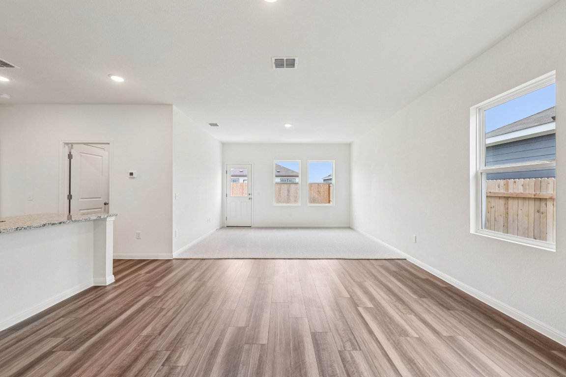1516 Morris Loop San Marcos, TX 78666 - Photo 10 of 40 Empty room with light wood-type flooring and recessed lighting