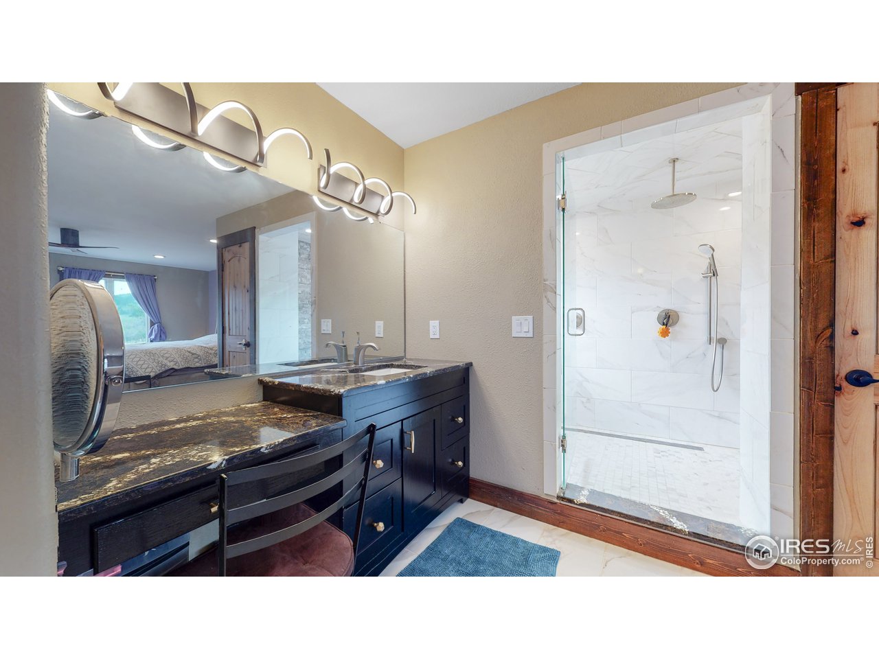 1200 Ponderosa Hill Road Lyons, CO 80540 - Photo 12 of 40 a kitchen with a refrigerator a sink and cabinets
