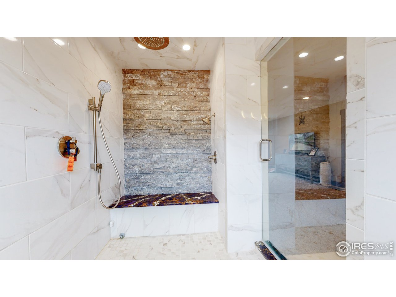 1200 Ponderosa Hill Road Lyons, CO 80540 - Photo 13 of 40 a bathroom with a tub shower and sink