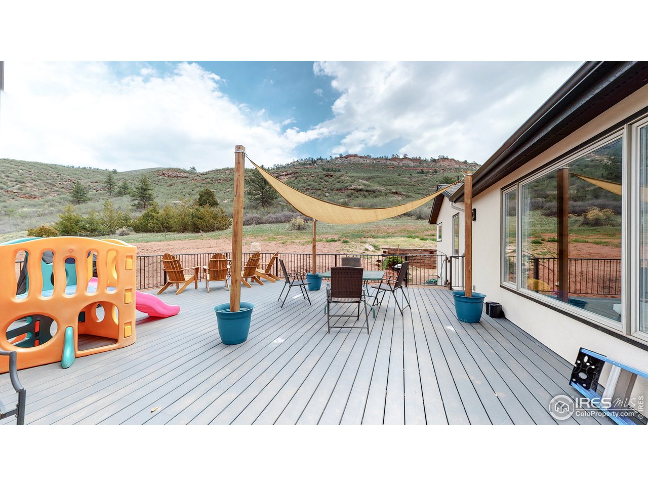 1200 Ponderosa Hill Road Lyons, CO 80540 - Photo 23 of 40 a view of balcony with couch and wooden floor