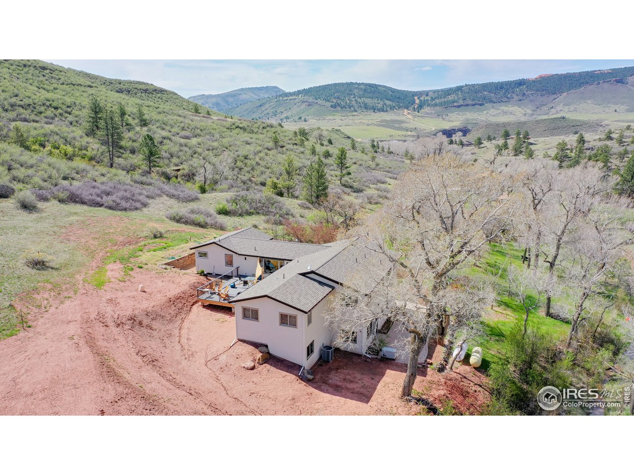 1200 Ponderosa Hill Road Lyons, CO 80540 - Photo 32 of 40 a aerial view of a house with a yard