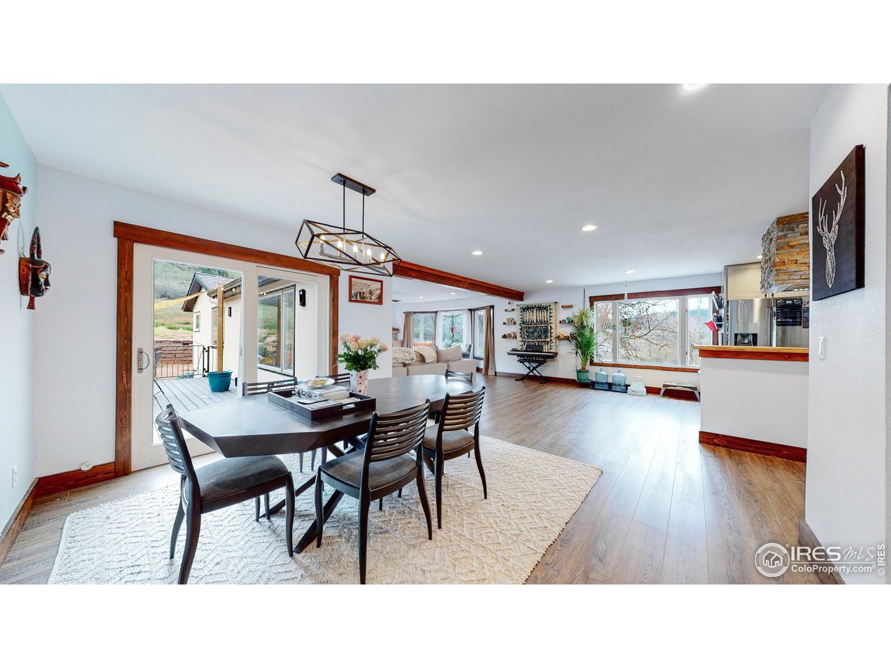 1200 Ponderosa Hill Road Lyons, CO 80540 - Photo 6 of 40 a dining room with furniture and wooden floor