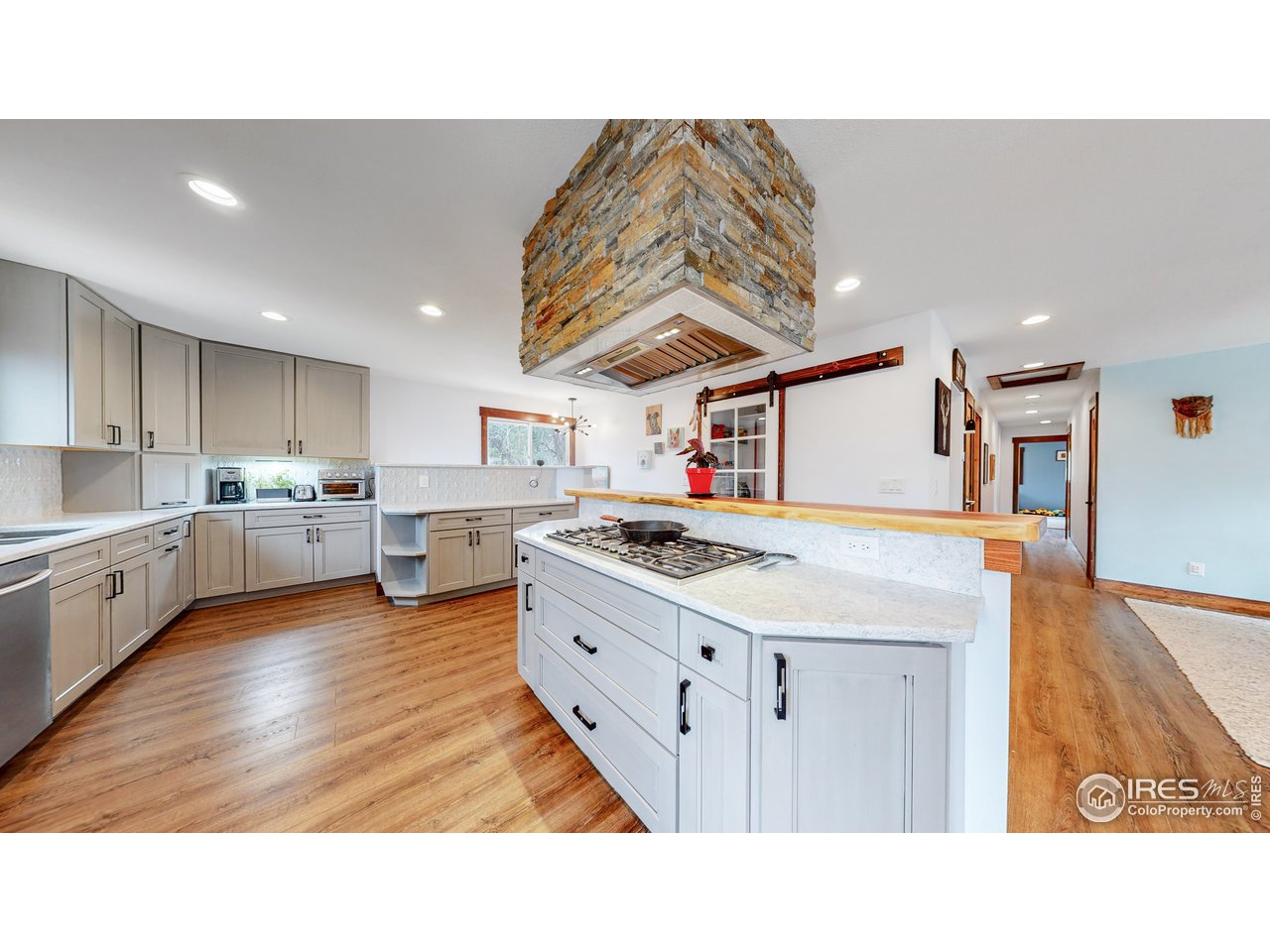 1200 Ponderosa Hill Road Lyons, CO 80540 - Photo 8 of 40 a kitchen with a stove a refrigerator and a sink