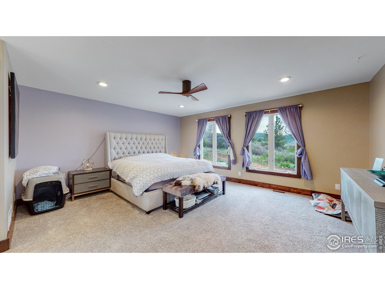 1200 Ponderosa Hill Road Lyons, CO 80540 - Photo 10 of 40 a living room with a bed furniture and a window