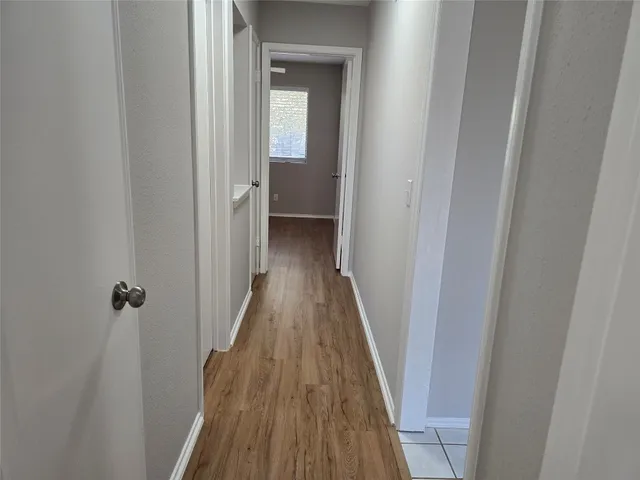 a view of a bathroom from the hallway