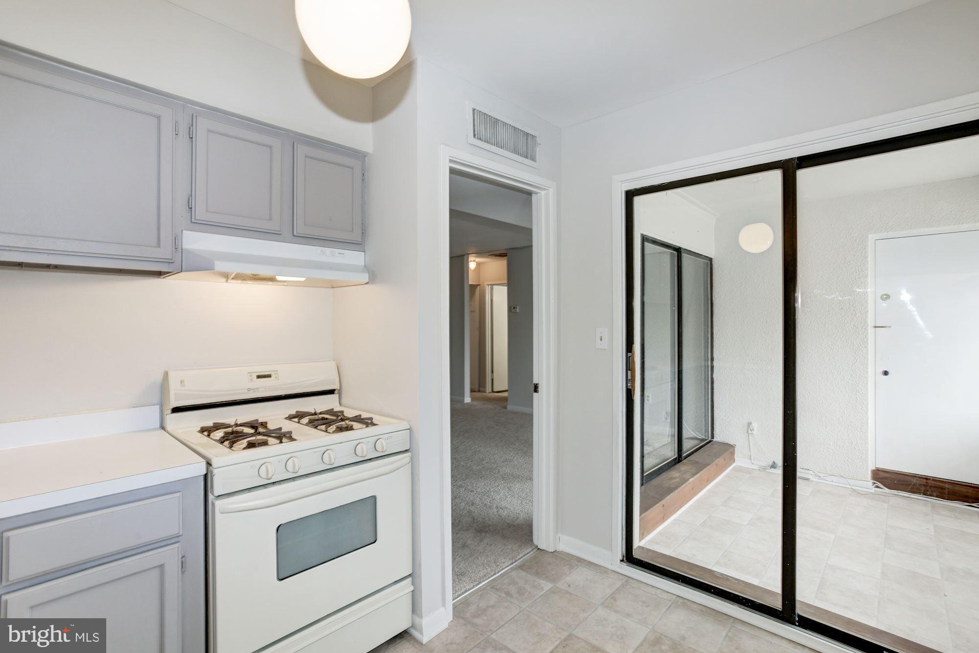 5860 Thunder Hill Road, Unit 2C Columbia, MD 21045 - Photo 12 of 22 Kitchen has sliders to sun room
