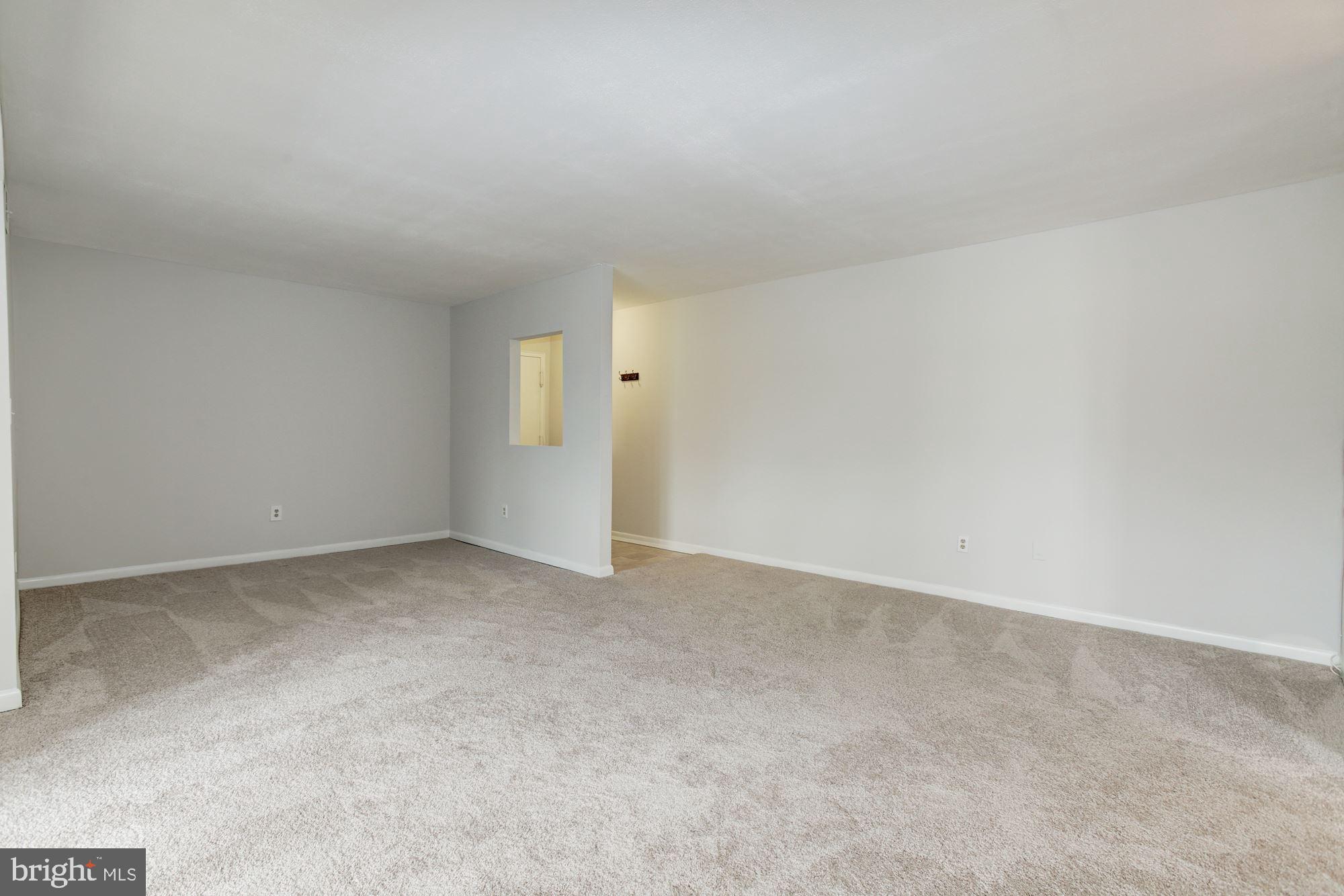 5860 Thunder Hill Road, Unit 2C Columbia, MD 21045 - Photo 7 of 22 Living room view toward foyer