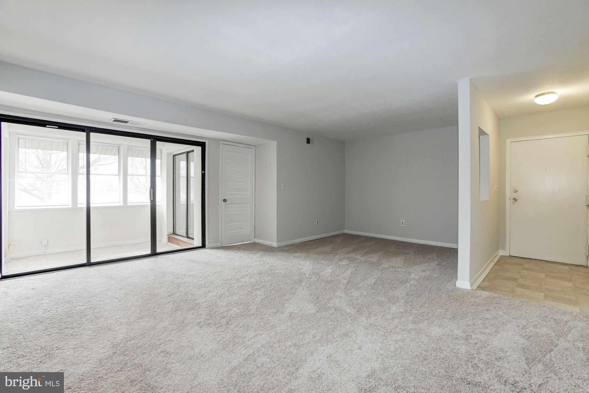 5860 Thunder Hill Road, Unit 2C Columbia, MD 21045 - Photo 8 of 22 Living room and dining room