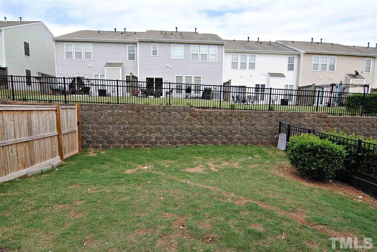 8220 Saltwood Place Raleigh, NC 27617 - Photo 11 of 15 a front view of a house with a yard