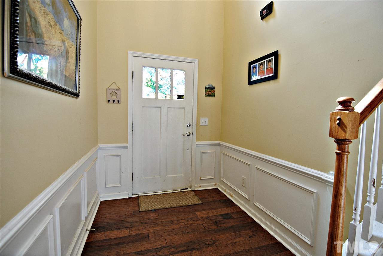 8220 Saltwood Place Raleigh, NC 27617 - Photo 3 of 15 a view of an entryway with wooden floor