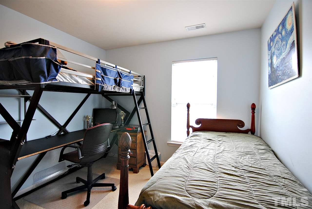 8220 Saltwood Place Raleigh, NC 27617 - Photo 10 of 15 a bedroom with furniture and a window