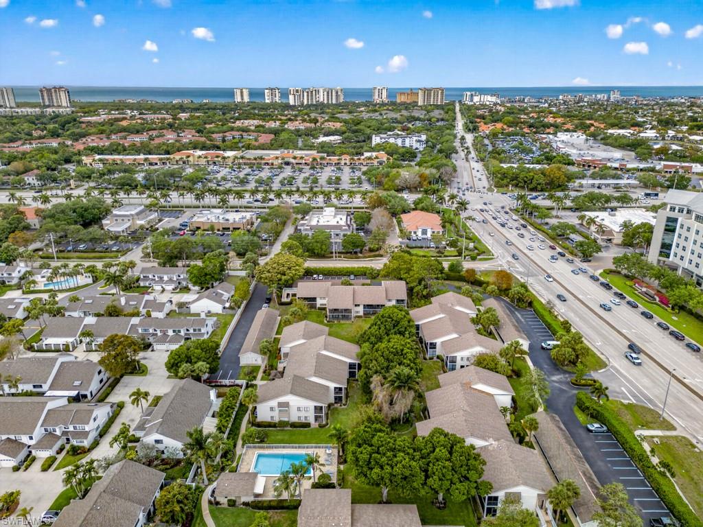 910 Vanderbilt Beach Road, Unit 317W Naples, FL 34108 - Photo 1 of 14 an aerial view of residential houses with outdoor space