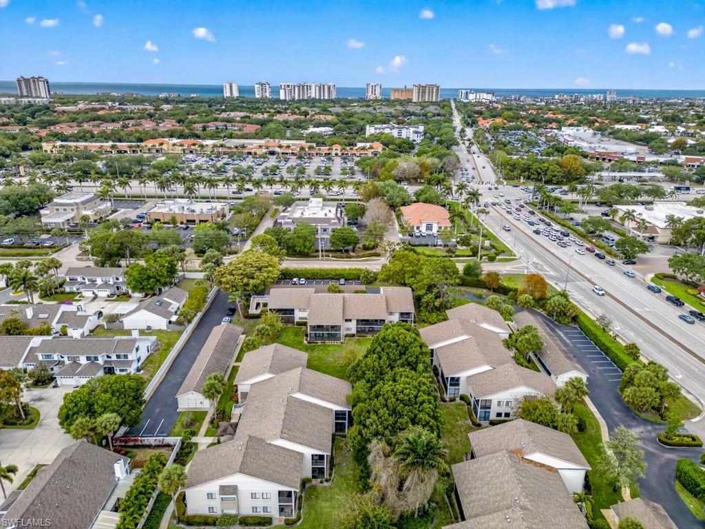 910 Vanderbilt Beach Road, Unit 317W Naples, FL 34108 - Photo 14 of 14 an aerial view of residential houses with outdoor space and river
