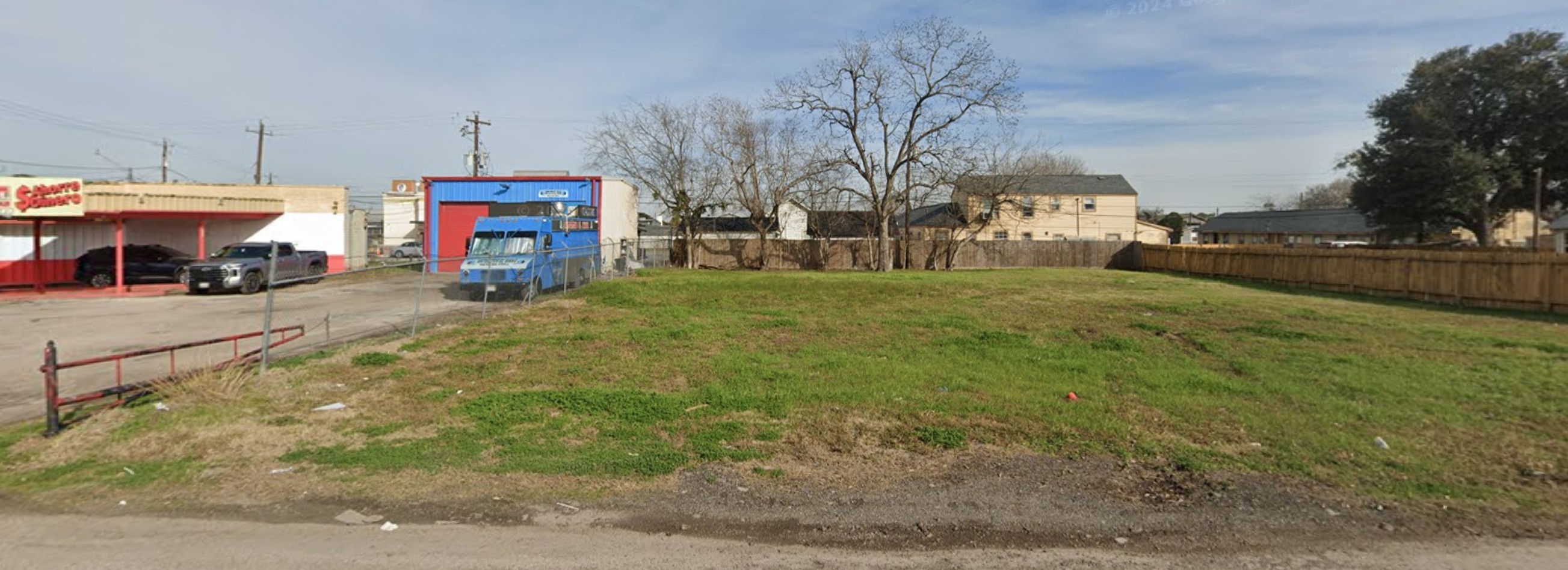 1009 Lawrence Street Rosenberg, TX 77471 - Photo 2 of 3 a view of road and car parked