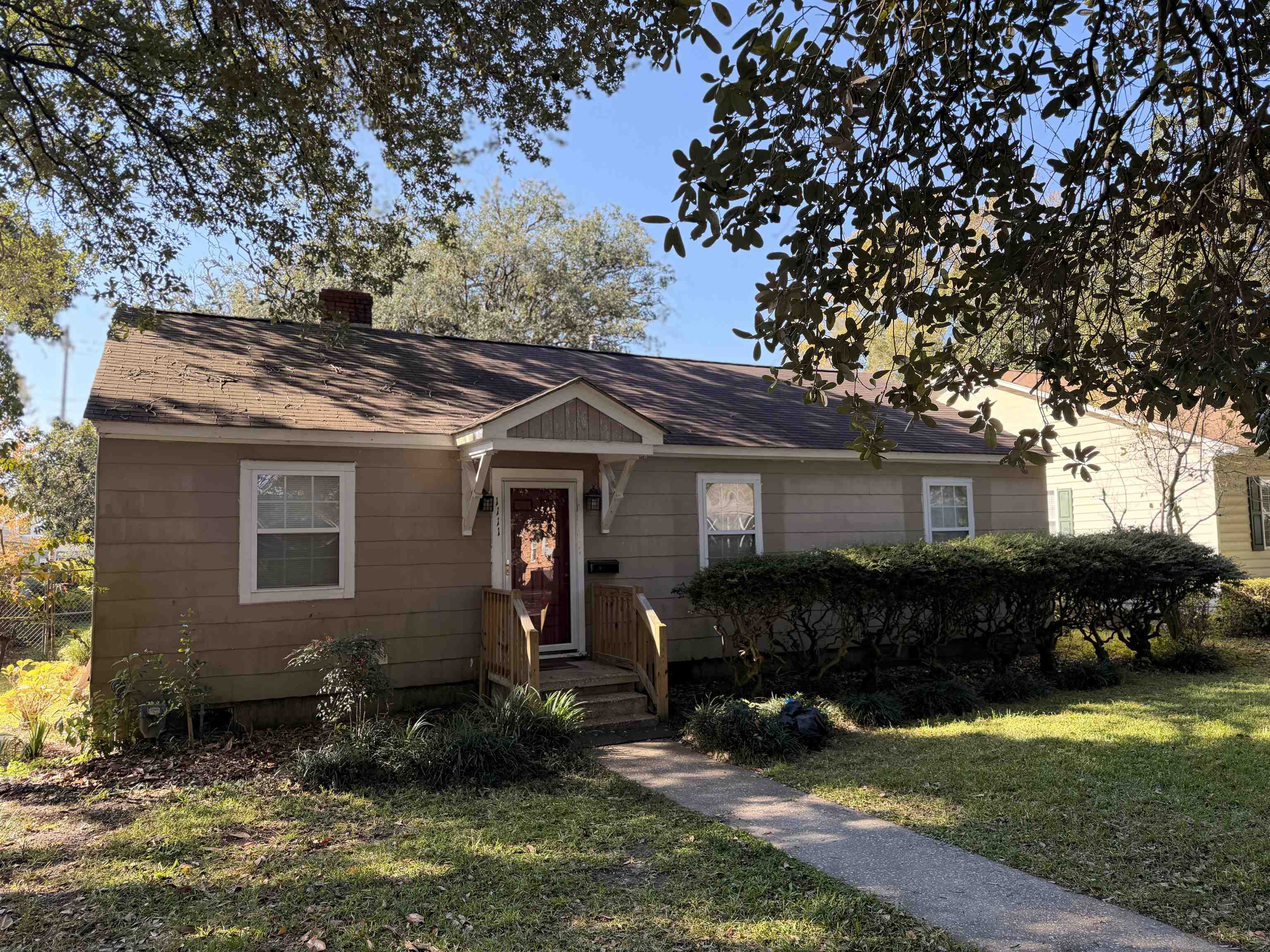 1111 Palmetto Street Georgetown, SC 29440 - Photo 1 of 36 Bungalow-style house featuring a chimney, a front yard, and roof with shingles