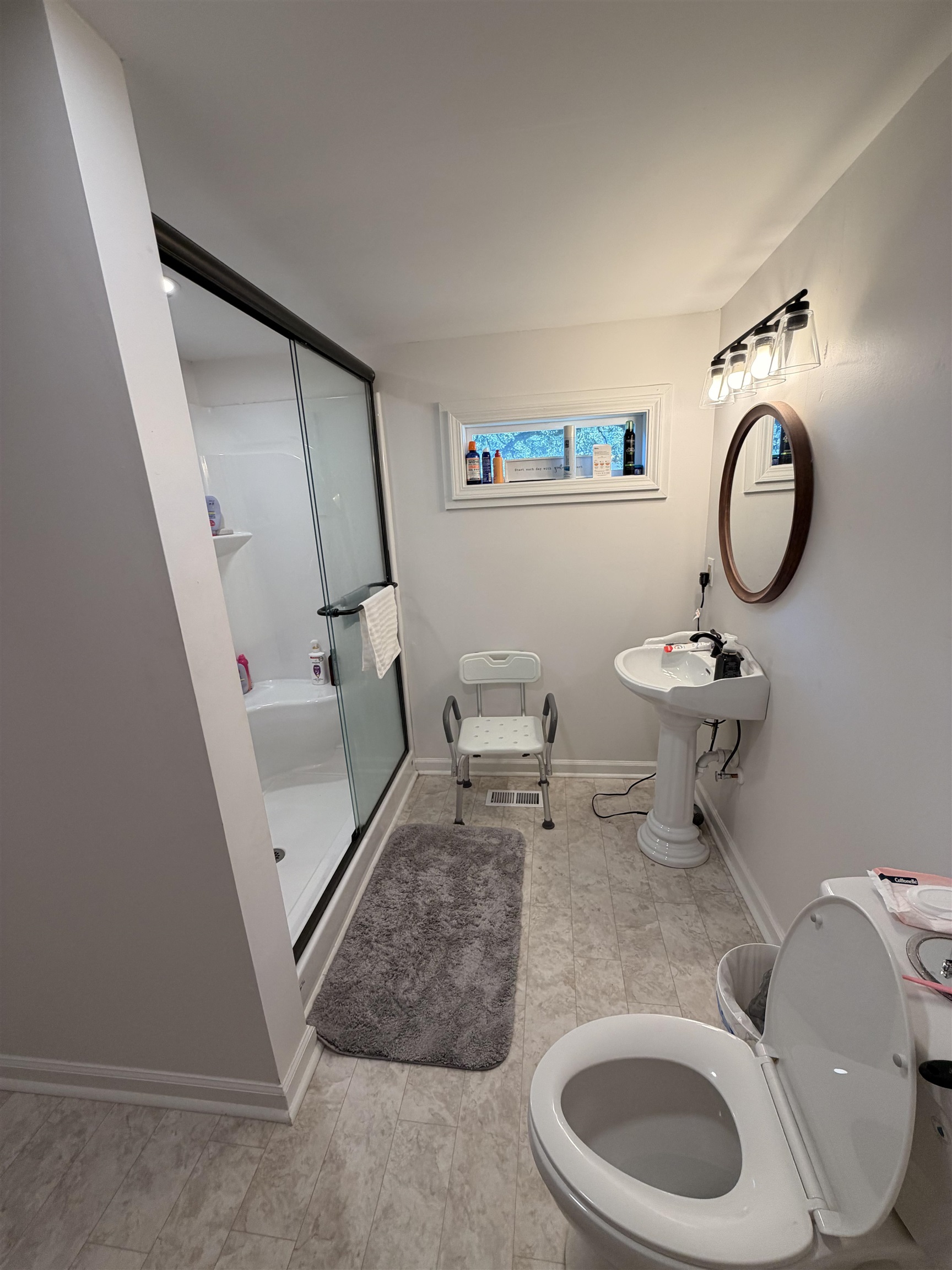 1111 Palmetto Street Georgetown, SC 29440 - Photo 12 of 36 Kitchen featuring appliances with stainless steel finishes, light countertops, a textured ceiling, white cabinetry, and light tile patterned flooring