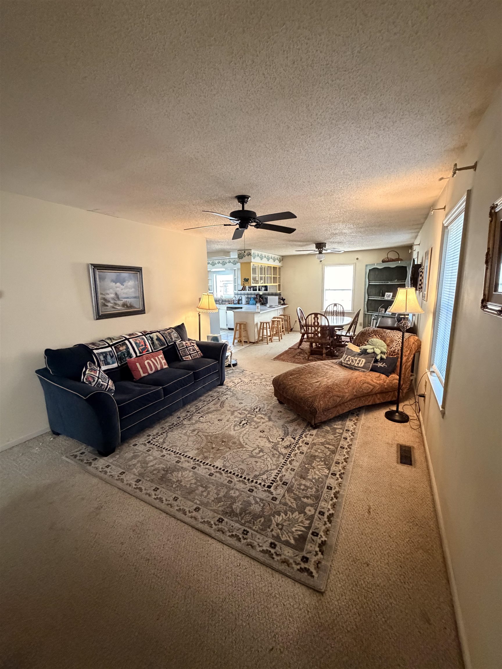 1111 Palmetto Street Georgetown, SC 29440 - Photo 20 of 36 Bedroom featuring dark colored carpet, a textured ceiling, and ceiling fan