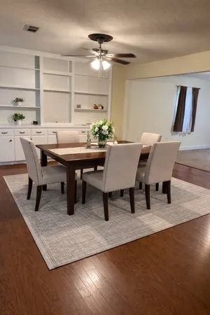 a view of a dining room with furniture