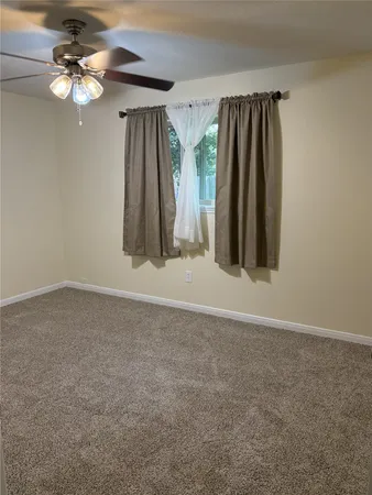 a view of a room with closet and fan