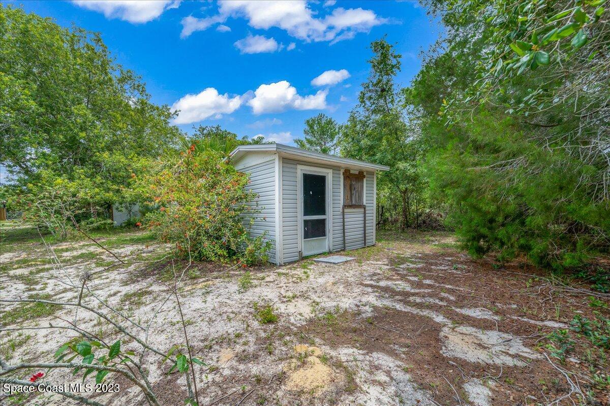 4885 Sand Point Road Grant, FL 32949 - Photo 12 of 36 a view of a house with a yard