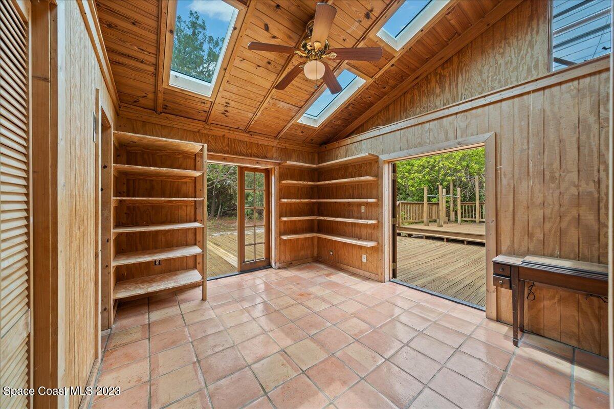 4885 Sand Point Road Grant, FL 32949 - Photo 20 of 36 a view of empty room with white walls and windows