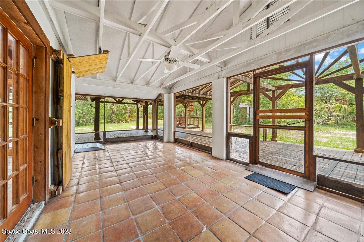 4885 Sand Point Road Grant, FL 32949 - Photo 24 of 36 a view of empty room with wooden floor and fan