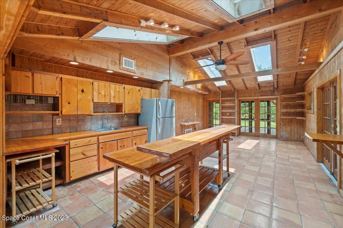 4885 Sand Point Road Grant, FL 32949 - Photo 30 of 36 a view of a kitchen with furniture and a kitchen