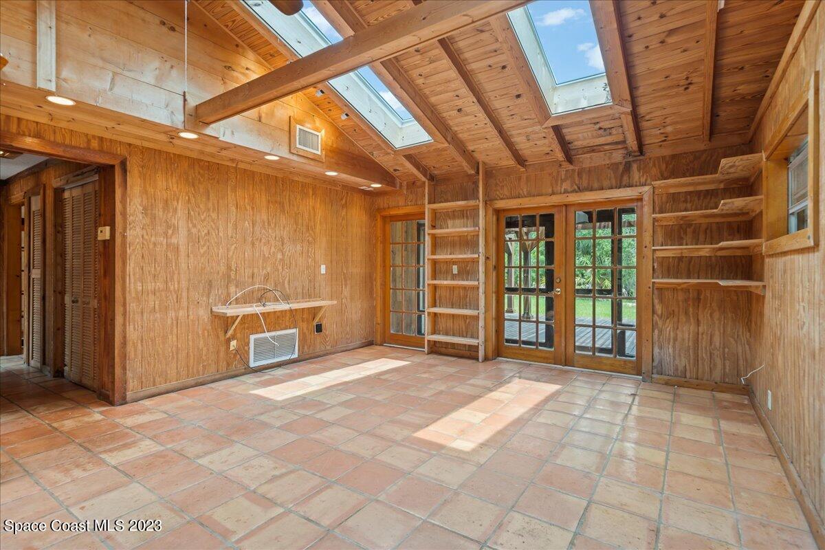 4885 Sand Point Road Grant, FL 32949 - Photo 31 of 36 a view of a room with wooden walls