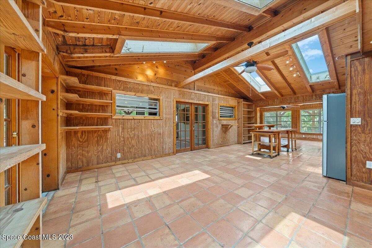 4885 Sand Point Road Grant, FL 32949 - Photo 32 of 36 a view of a hallway with chairs