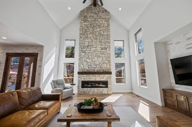 a room with a bed and windows