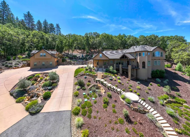 a view of a street with a garden