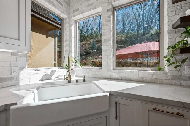 a living room with kitchen island furniture and a kitchen view