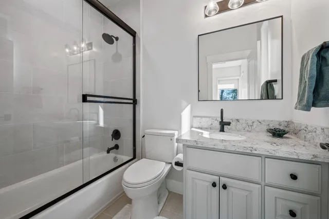 a sign broad in front of flowers