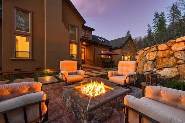 a view of a hallway with wooden floor and stairs