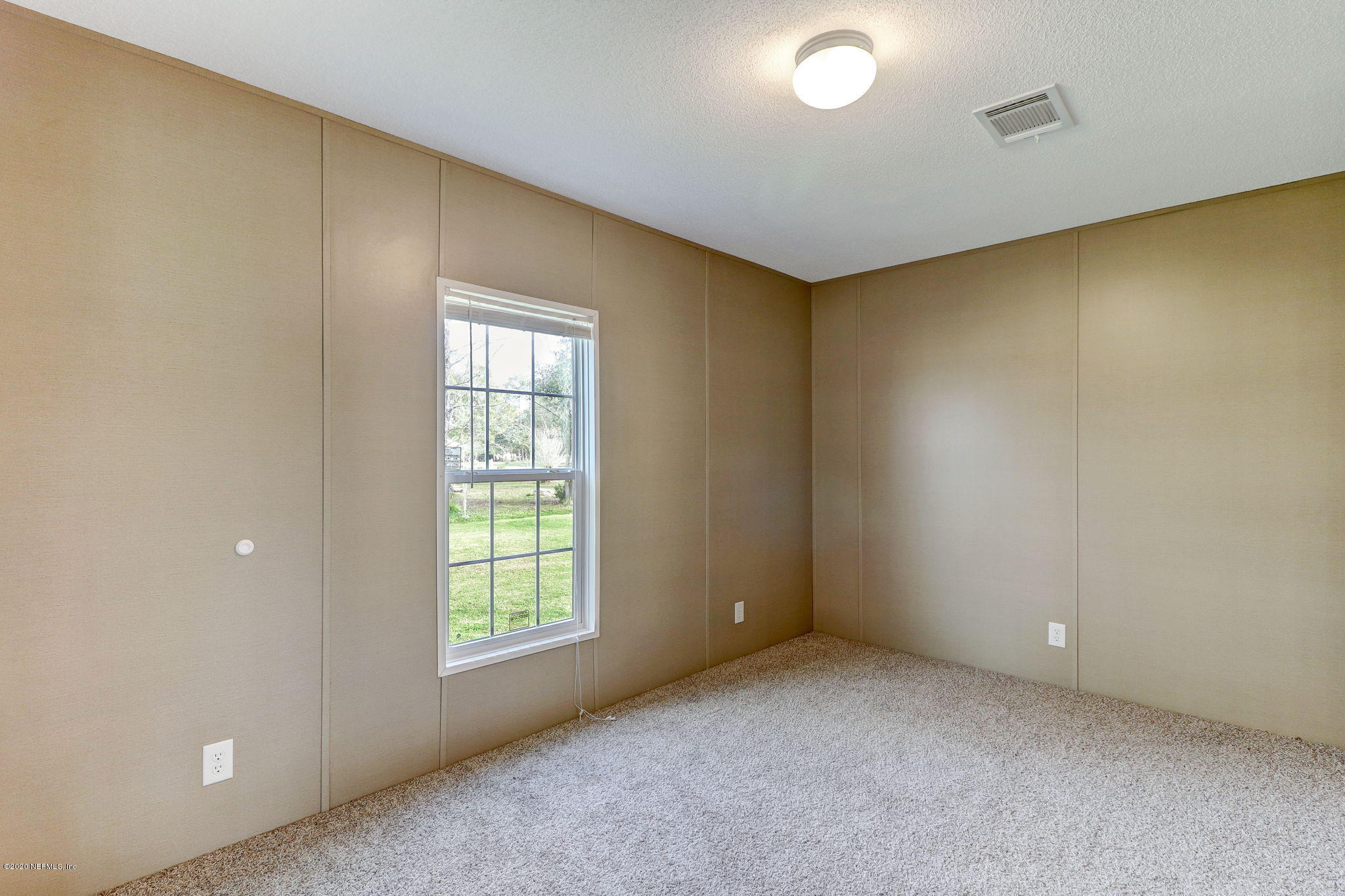 54350 Plantation Road Callahan, FL 32011 - Photo 20 of 46 a view of an empty room with a window