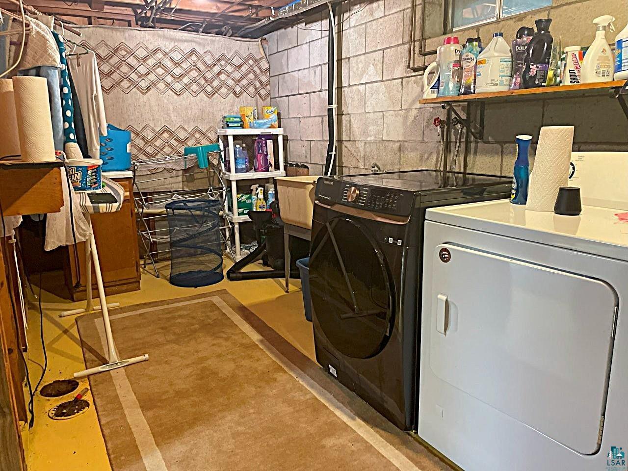 42 Locust Drive Babbitt, MN 55706 - Photo 32 of 50 Laundry area offers double utility sink & lots of functional space for getting the task done!