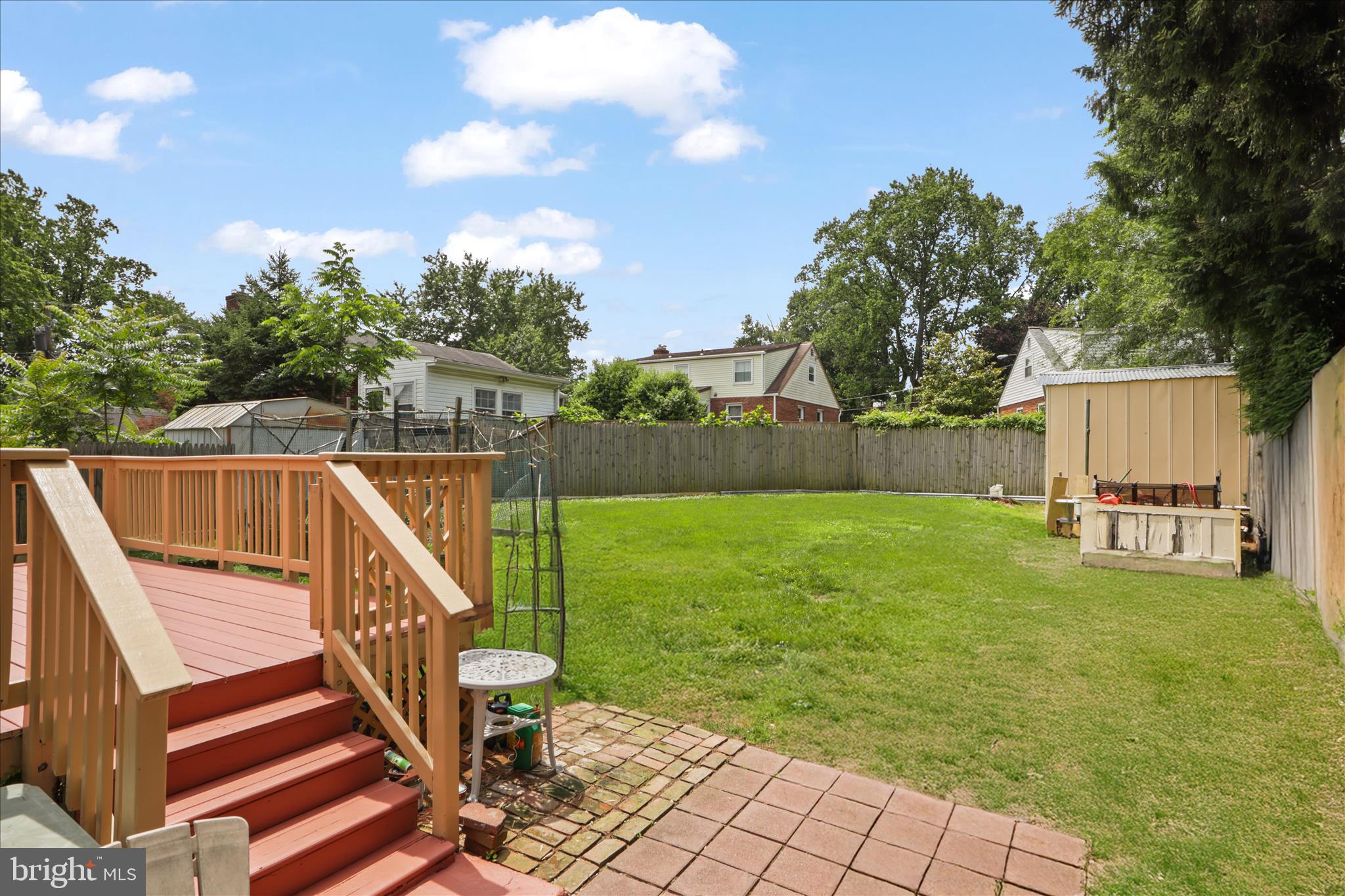 10602 Edgewood Avenue Silver Spring, MD 20901 - Photo 12 of 66 a view of a chair and table on the garden