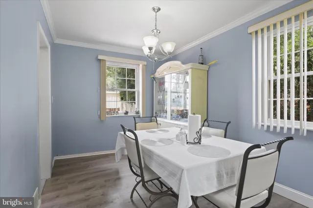 a kitchen with stainless steel appliances granite countertop a sink a stove and cabinets