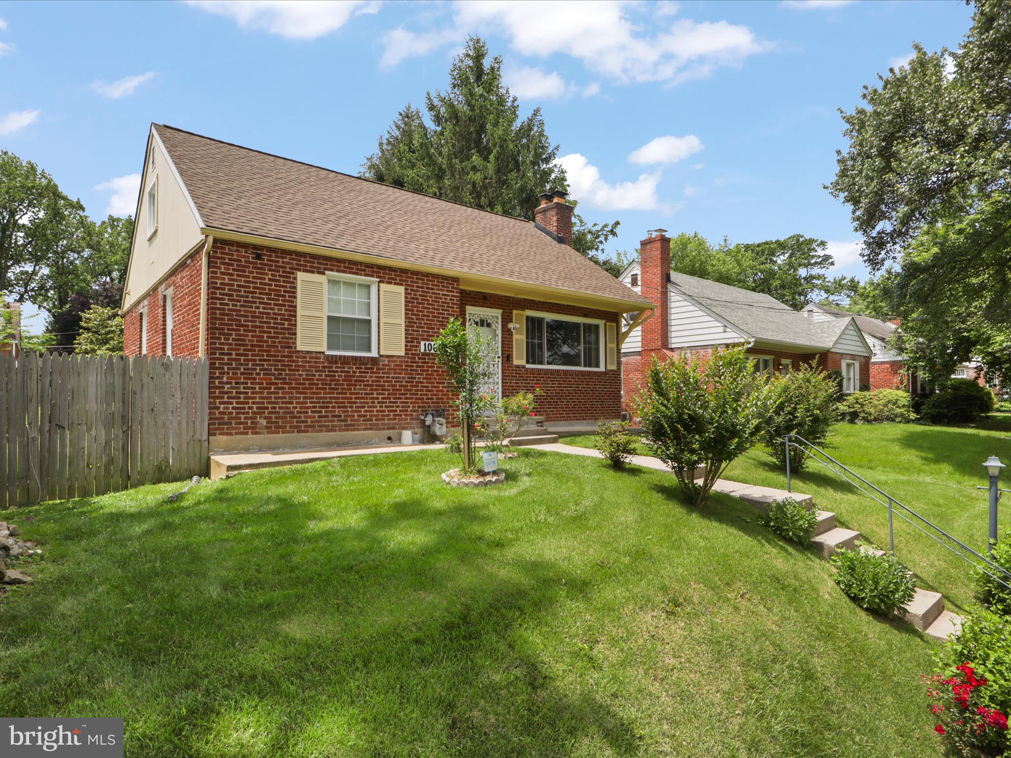 10602 Edgewood Avenue Silver Spring, MD 20901 - Photo 2 of 66 a backyard of a house with table and chairs