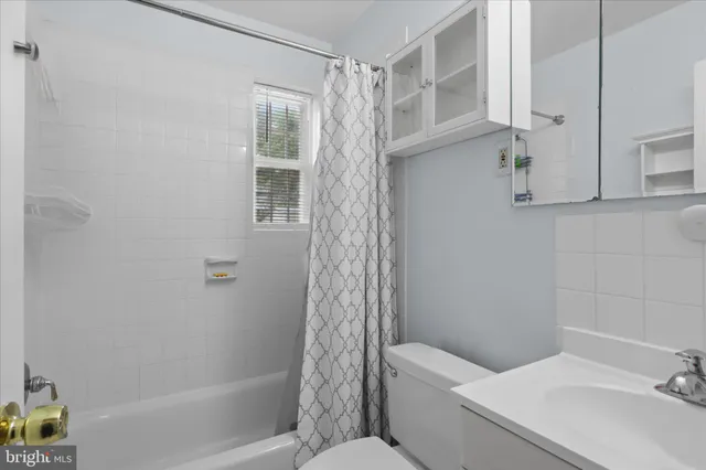 an empty room with white walls and air conditioner