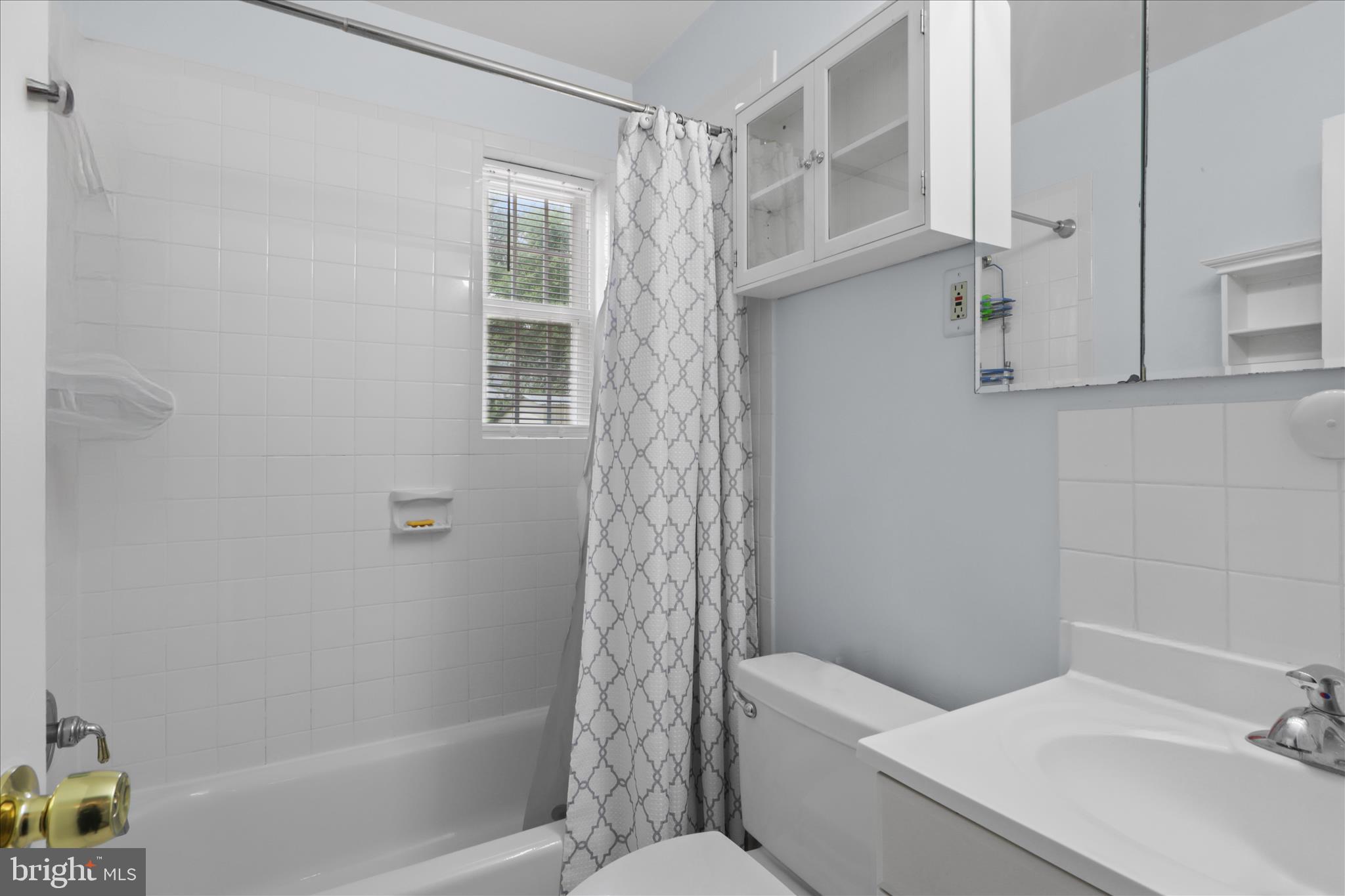 10602 Edgewood Avenue Silver Spring, MD 20901 - Photo 21 of 66 a bathroom with a sink a toilet and shower