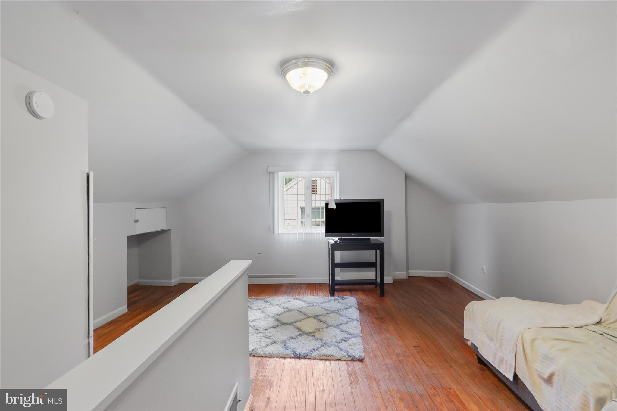 10602 Edgewood Avenue Silver Spring, MD 20901 - Photo 22 of 66 a living room with furniture and a wooden floor